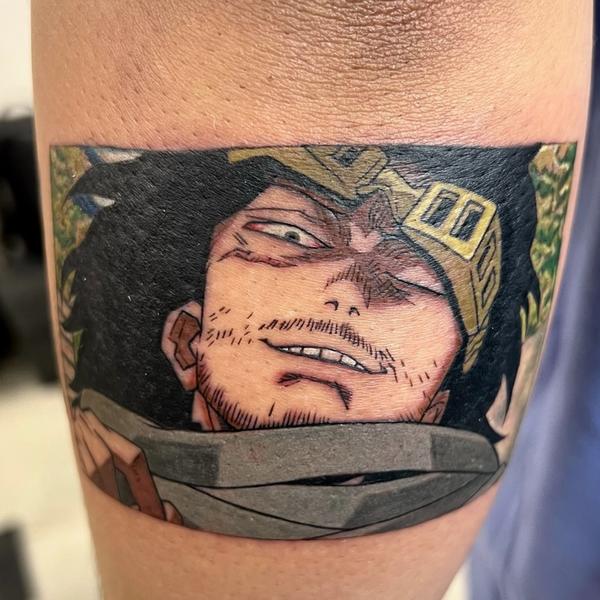 This colourful anime tattoo is