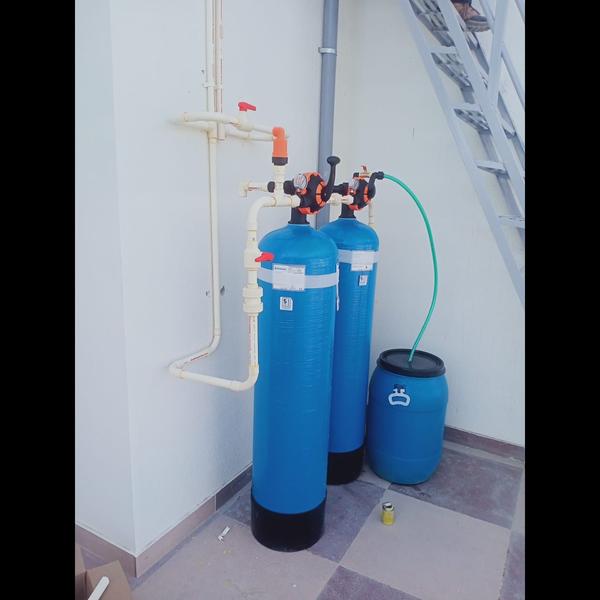 A water softener is a device d