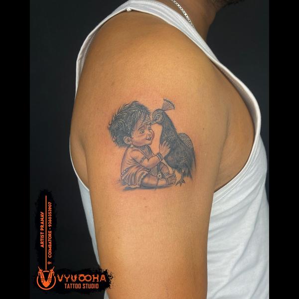 Baby Krishna with Peacock Tatt