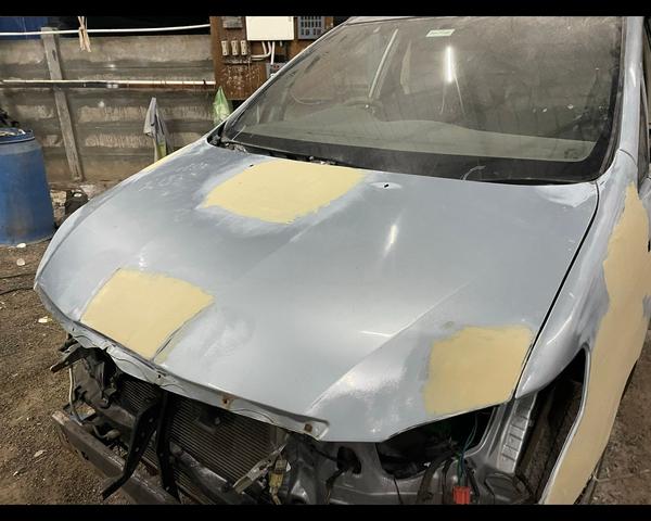 car tinkering and painting tri