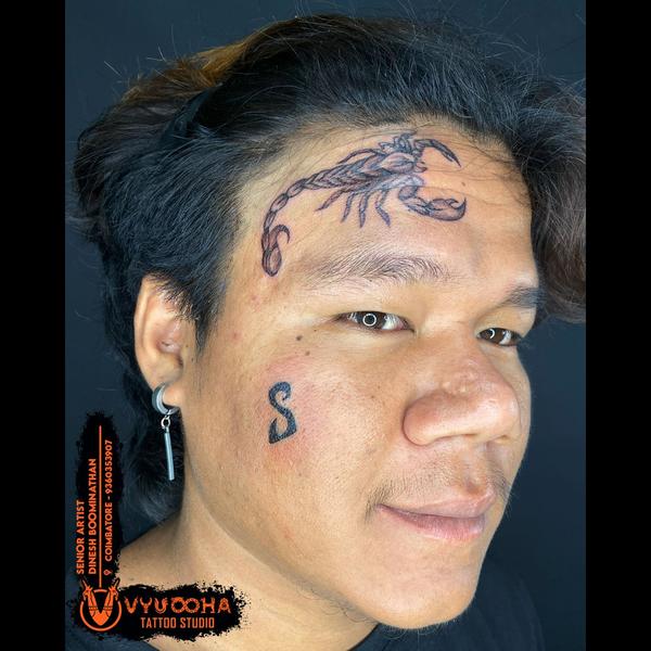 Scorpion Forehead Tattoo & S L