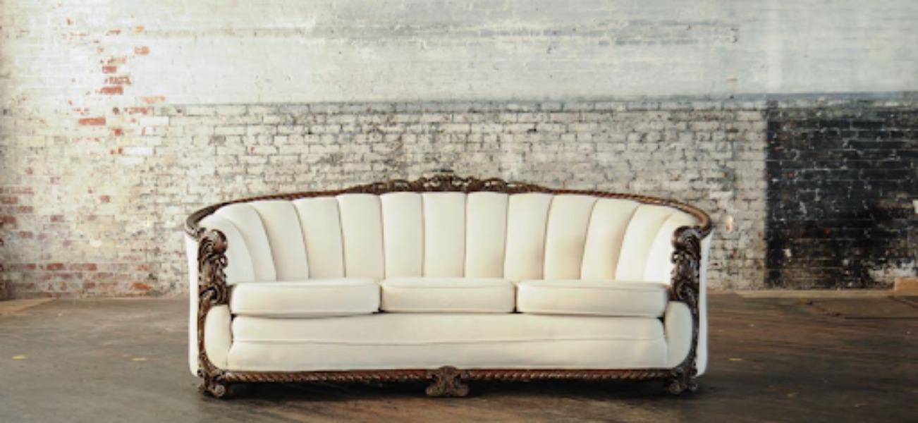 A wooden sofa brings a sense of stability and eleg