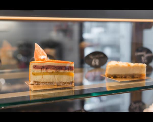 A cake display counter serves as the focal point o