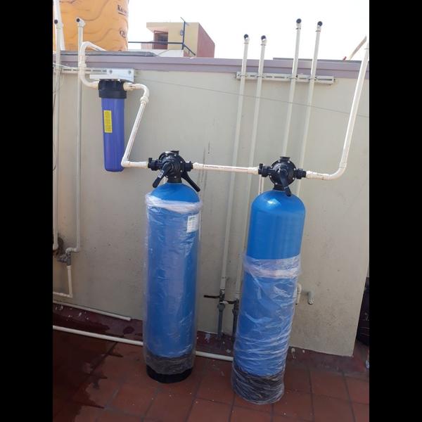 A water softener is a device d