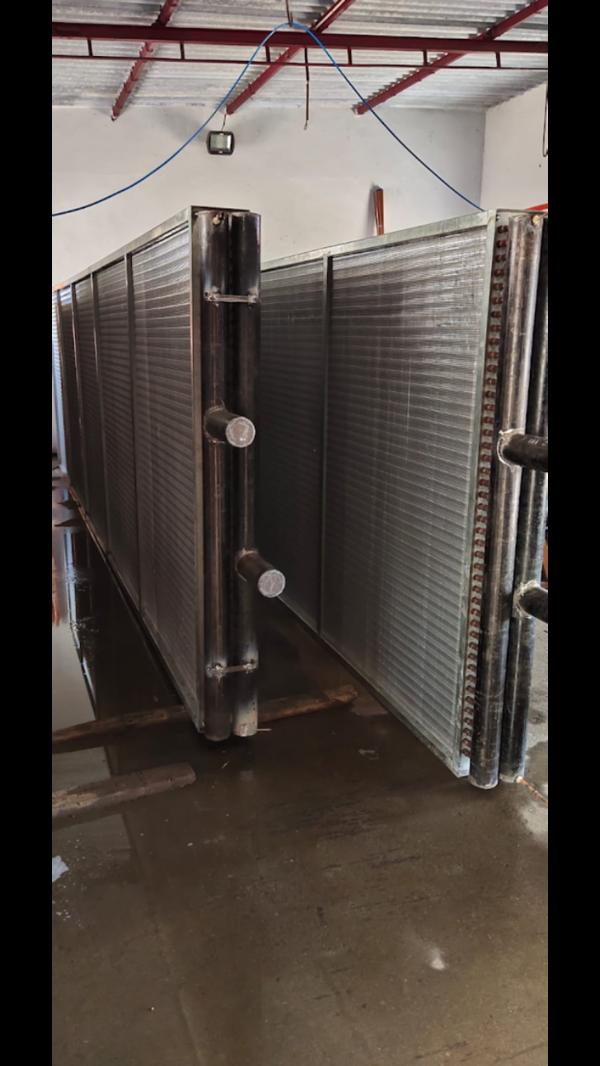 A cooling coil heat exchanger combines efficient h
