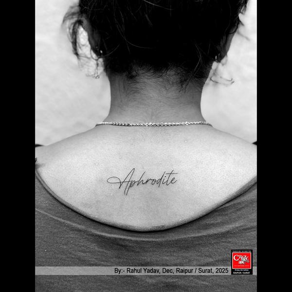 “APHRODITE” SCRIPT TATTOO