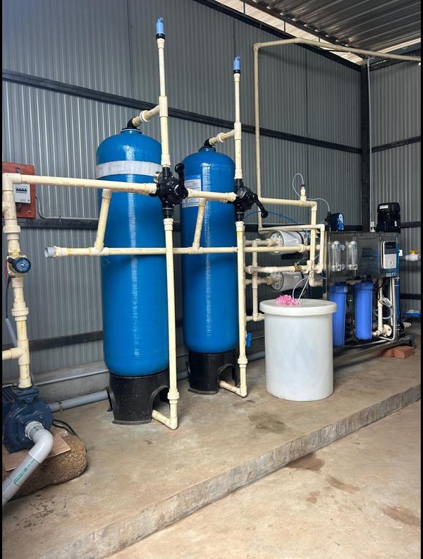 The system includes large blue pressurized vessels