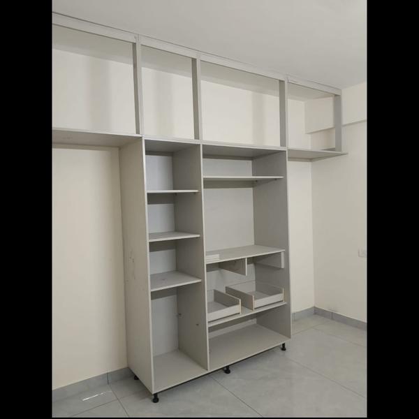 A wardrobe is a freestanding or built-in storage u