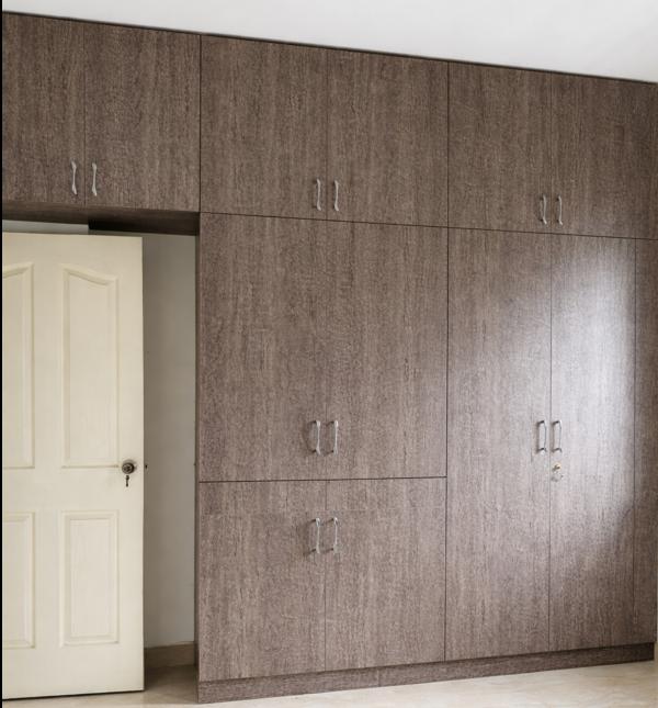 A stylish full-wall wardrobe designed to maximize 