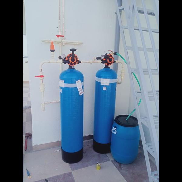 A water softener is a device d